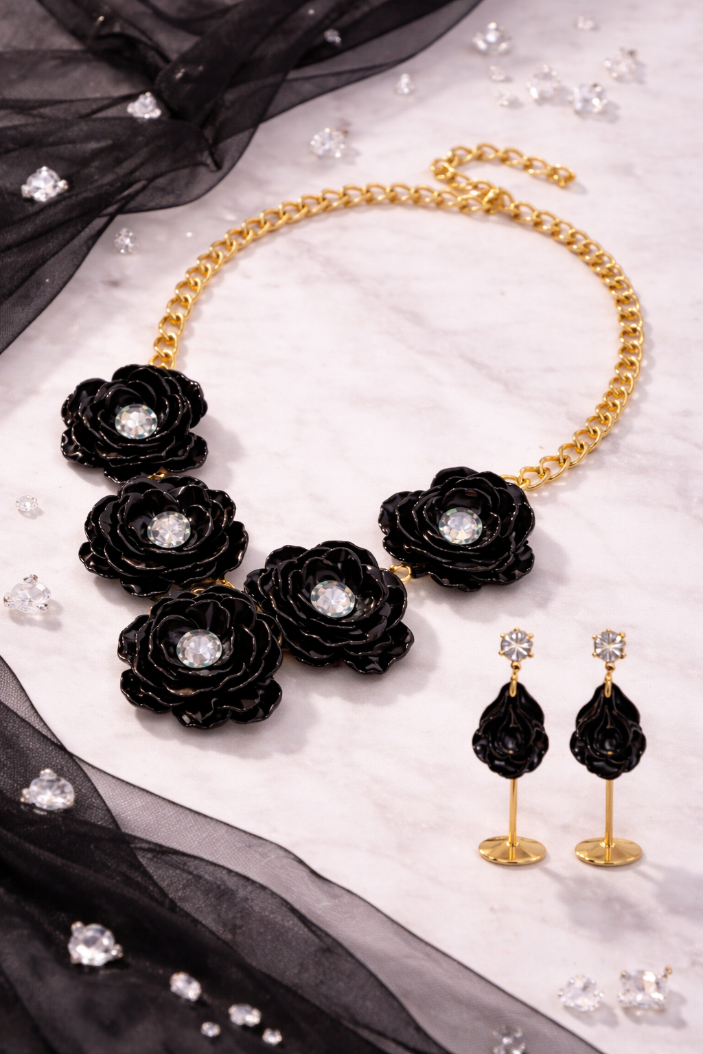 Black rose flower jewelry set featuring a bold gold tone necklace and matching drop earrings.